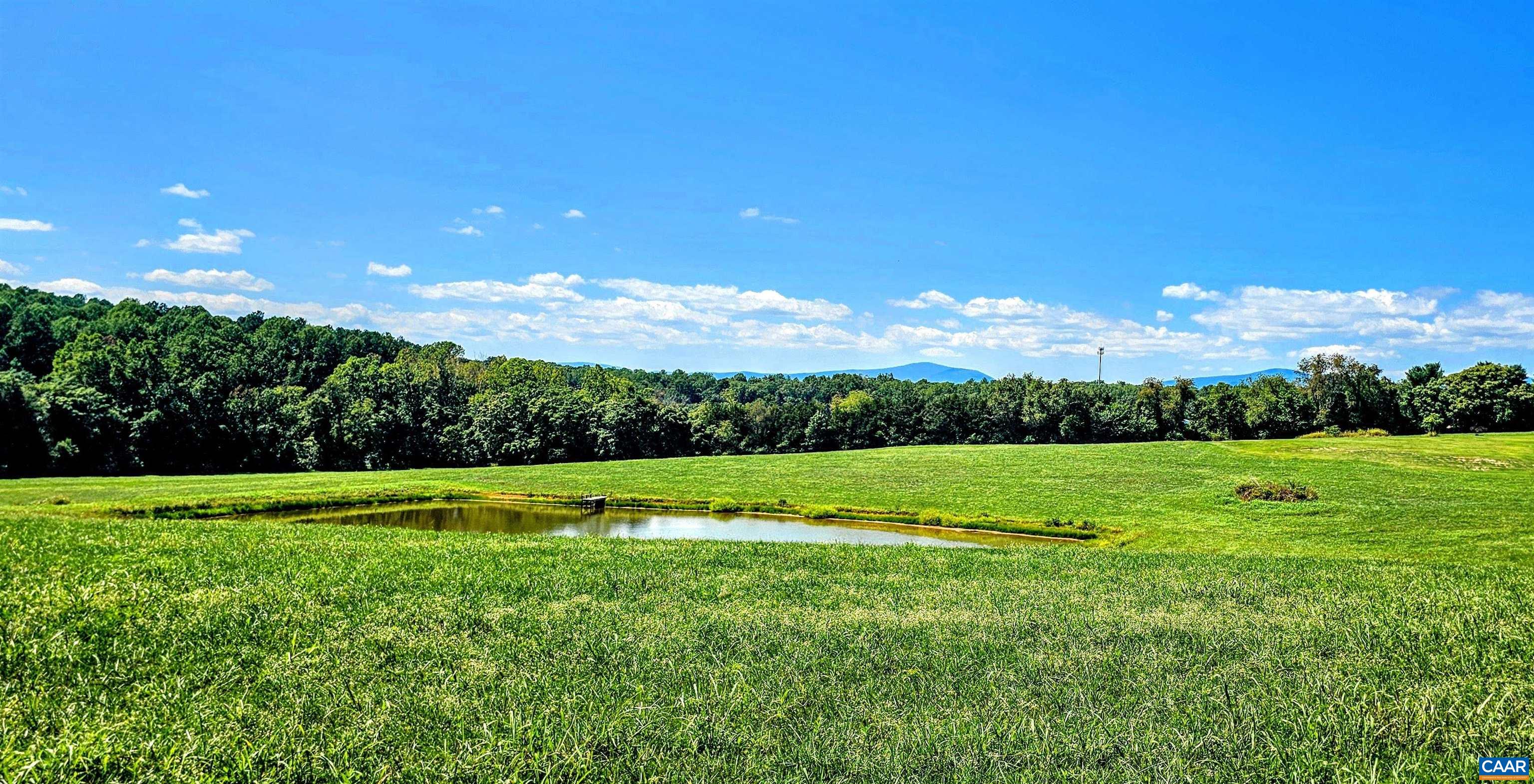 3470 Fredericksburg Road Ruckersville, VA 22968 - Photo 5 of 9 a view of field with grass and a street
