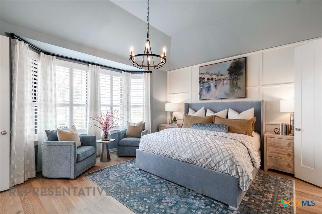 508 High Summit Drive Georgetown, TX 78628 - Photo 20 of 39 a bedroom with a large bed and a couch