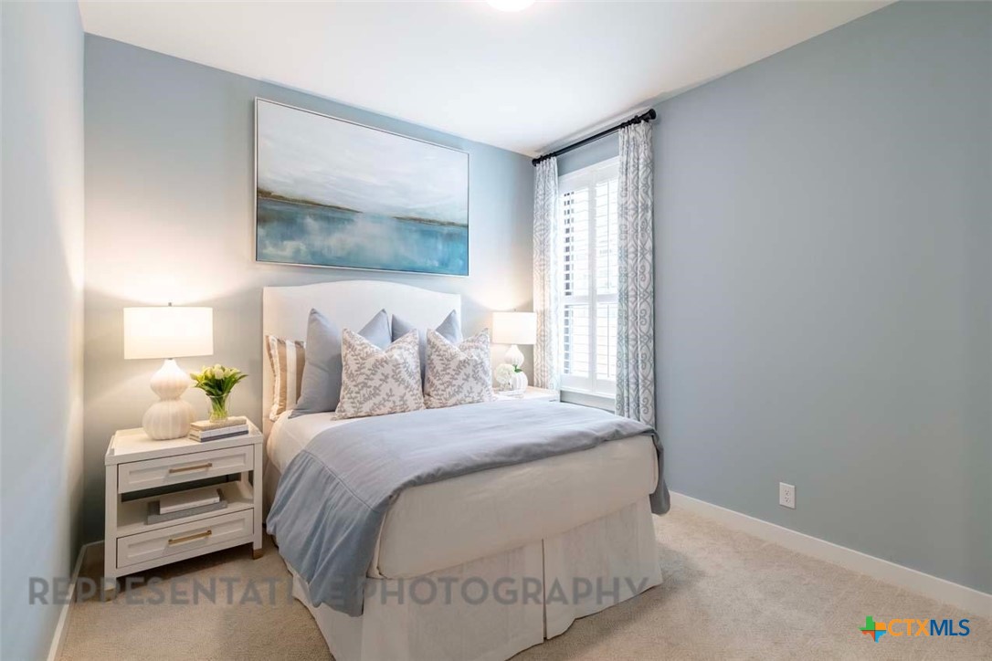 508 High Summit Drive Georgetown, TX 78628 - Photo 34 of 39 a bedroom with a bed and a window