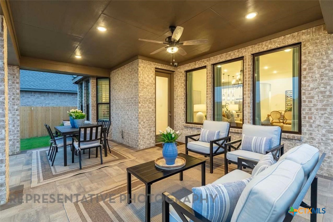 508 High Summit Drive Georgetown, TX 78628 - Photo 36 of 39 a living room with furniture and a large window