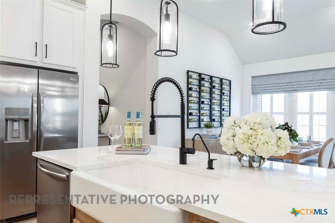 508 High Summit Drive Georgetown, TX 78628 - Photo 8 of 39 a kitchen with a table chairs and entryway
