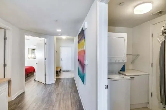 a view of an entryway with wooden floor
