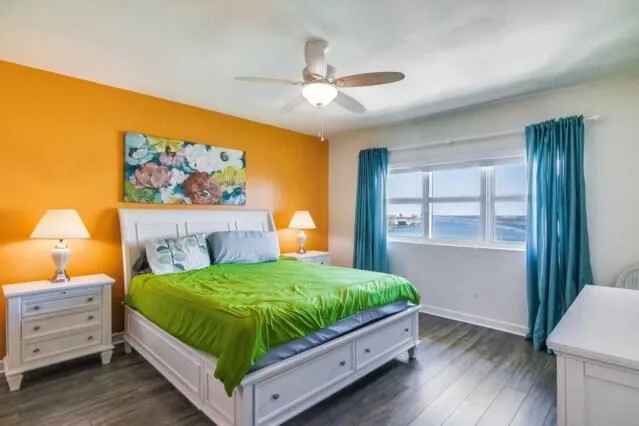 a bed room with a bed and a window