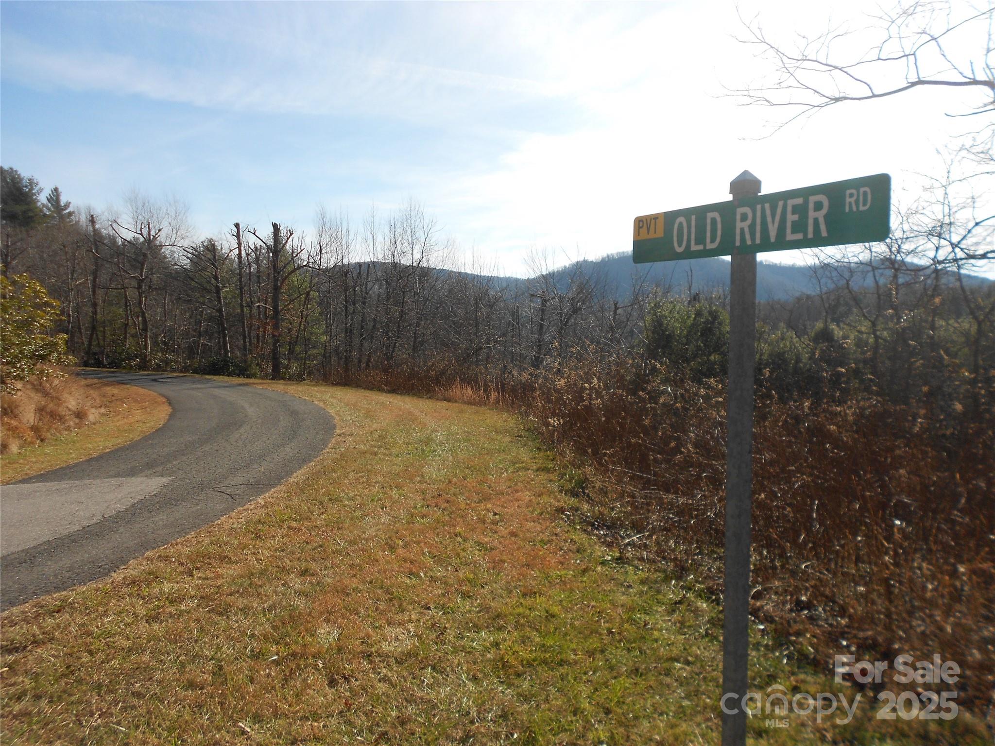 0 Old River Road West Jefferson, NC 28694 - Photo 3 of 12 a view of a street with a building in the background