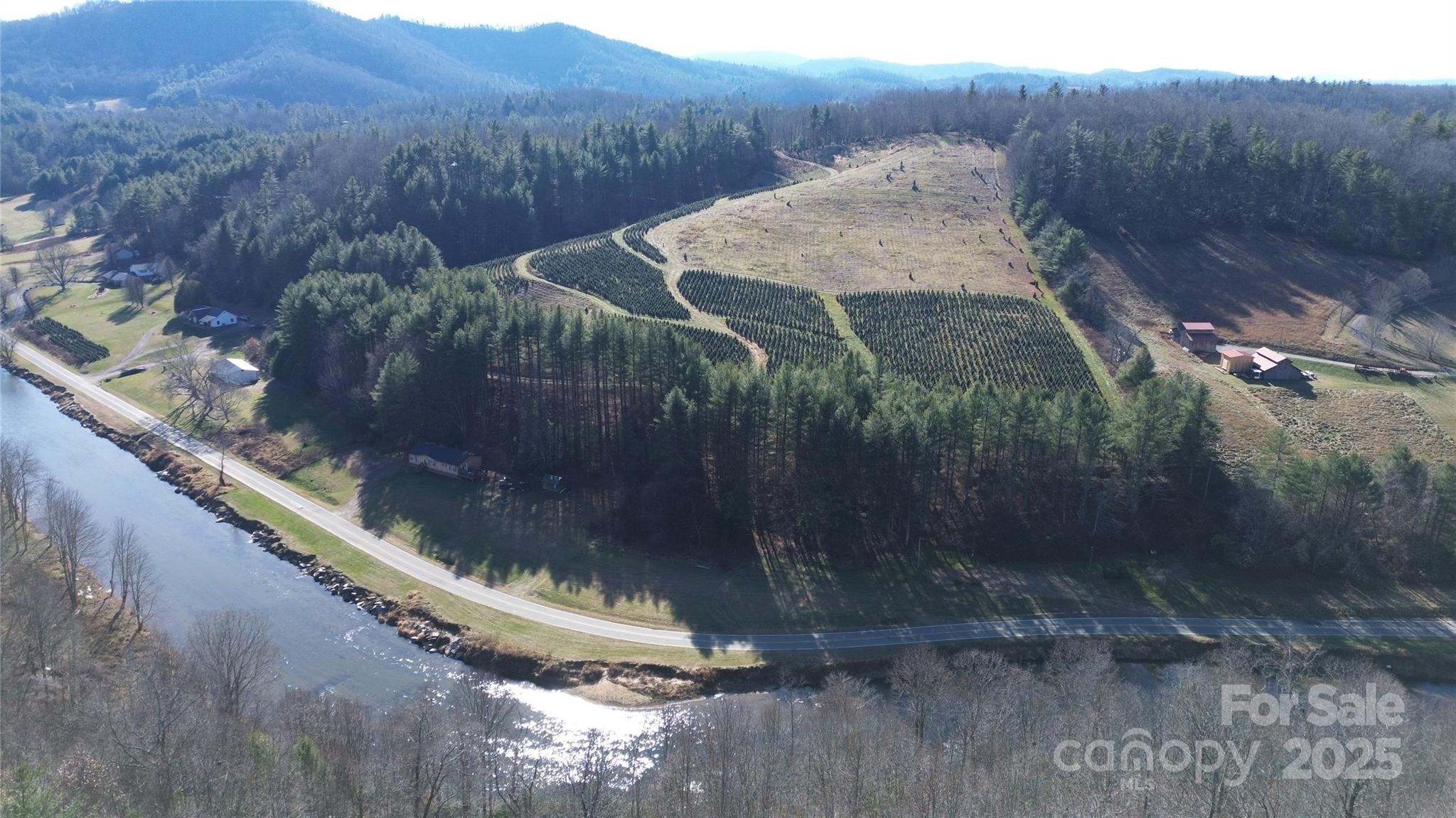 0 Old River Road West Jefferson, NC 28694 - Photo 9 of 12 a view of a small pool in middle of the green field