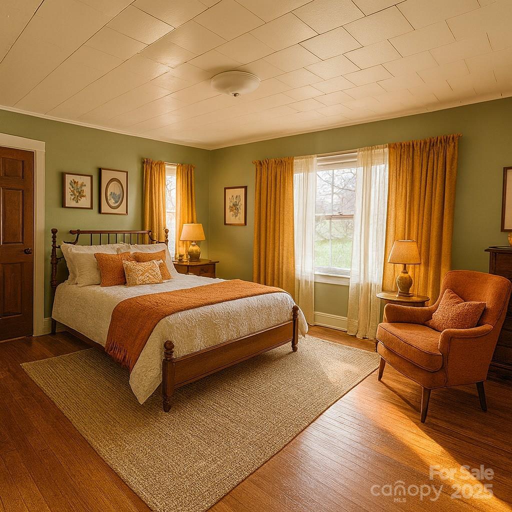 325 Sheldon Street Hudson, NC 28638 - Photo 12 of 33 a bedroom with a bed and a couch