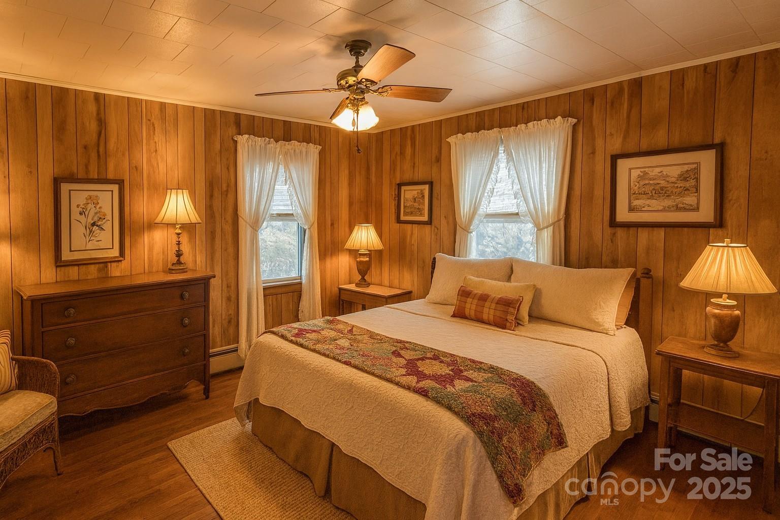 325 Sheldon Street Hudson, NC 28638 - Photo 14 of 33 a bedroom with a bed and wooden floor