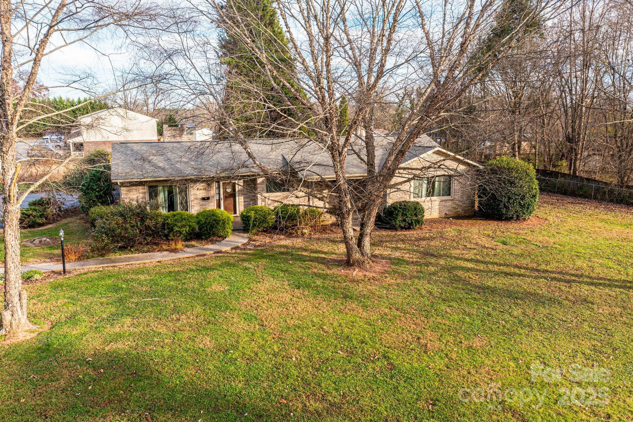 325 Sheldon Street Hudson, NC 28638 - Photo 20 of 33 a view of a yard with a house in the background