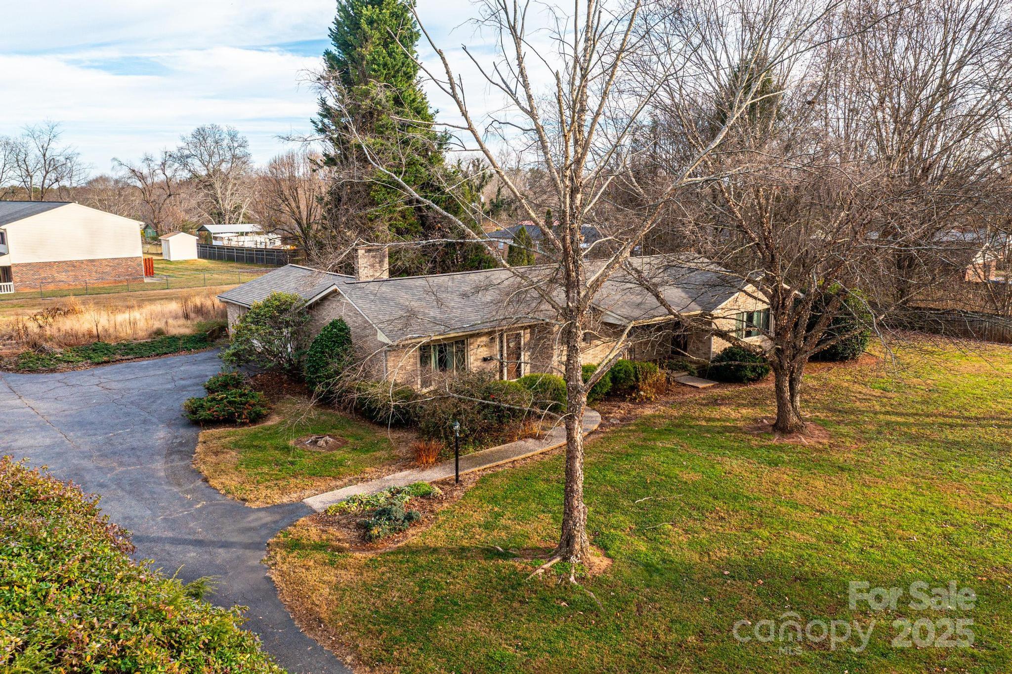 325 Sheldon Street Hudson, NC 28638 - Photo 21 of 33 a view of a house with a yard
