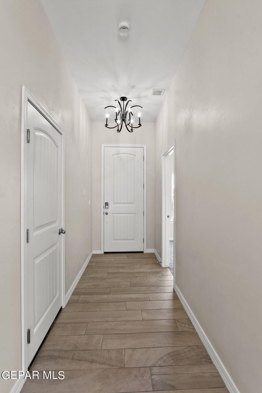 6064 Summer Ridge Sunland Park, NM 88008 - Photo 8 of 30 a view of a hallway with wooden floor