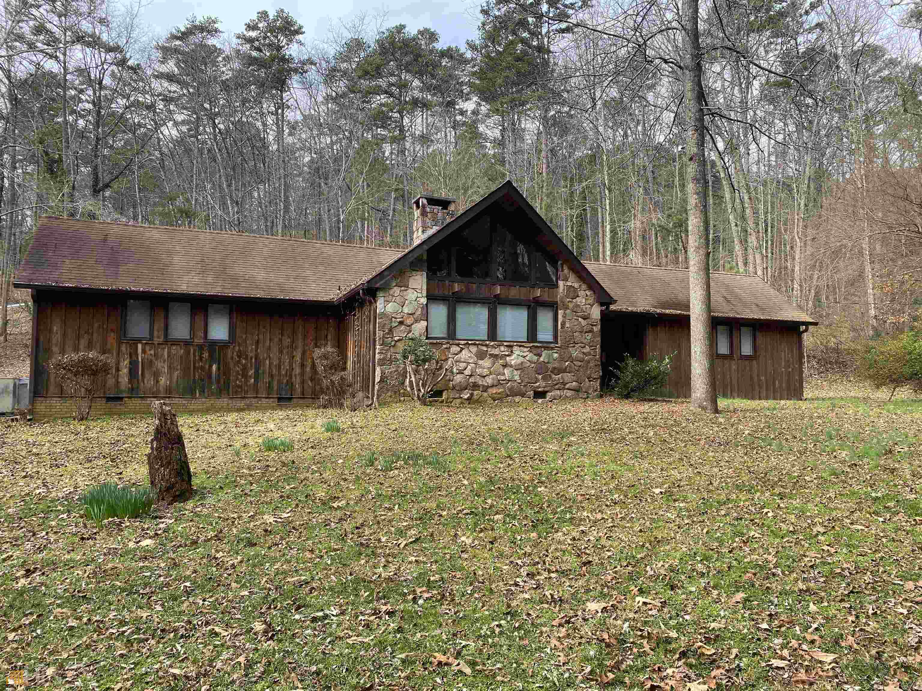 285 Featherston Road Southwest Rome, GA 30165 - Photo 1 of 1 a front view of a house with a yard and garage
