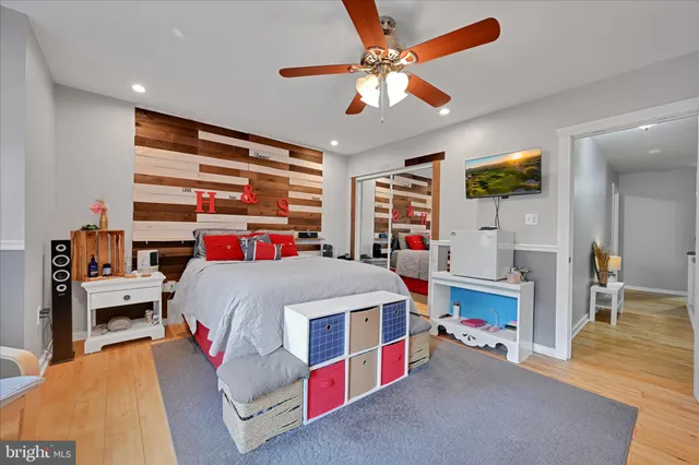 a bed room with a bed and a baby crib