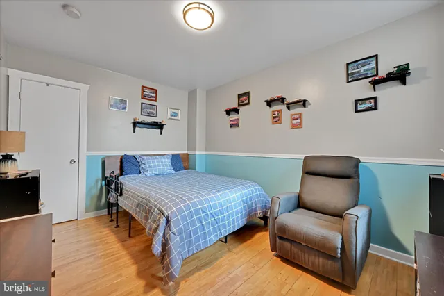 a bedroom with a bed and a couch