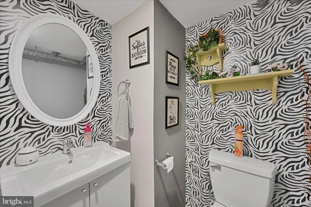 a bedroom with furniture and a flat screen tv