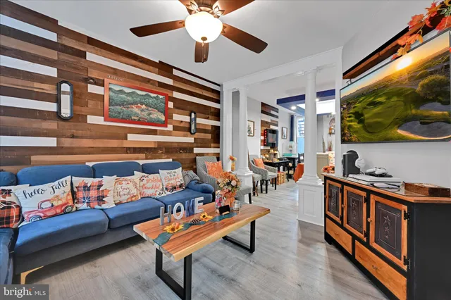 a reading room with furniture and a flat screen tv