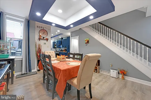 a dining room with furniture and entryway