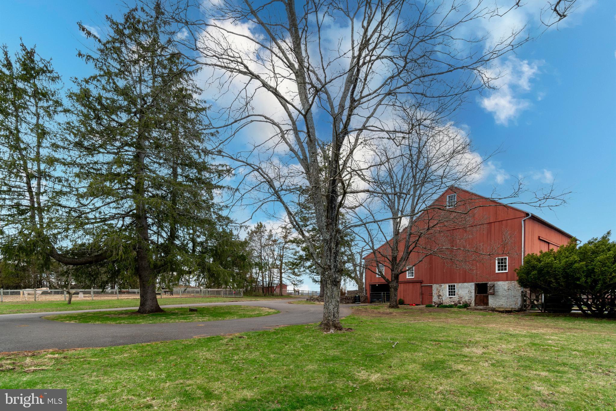 180 Municipal Road Pipersville, PA 18947 - Photo 6 of 60 a view of a big house with a big yard and large trees