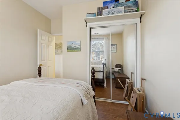 a bedroom with a bed and a mirror