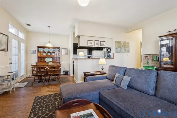 a living room with furniture and a rug