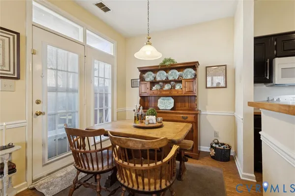 a dining room with furniture and window