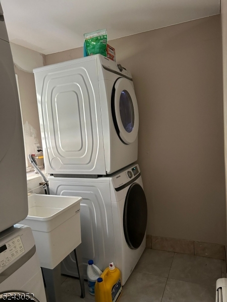 85 Eastern Way, Unit 2 Rutherford, NJ 07070 - Photo 14 of 14 a utility room with dryer and washer