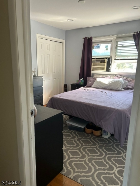 85 Eastern Way, Unit 2 Rutherford, NJ 07070 - Photo 9 of 14 a bedroom with a bed and a large window