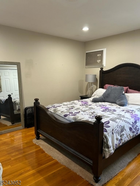 85 Eastern Way, Unit 2 Rutherford, NJ 07070 - Photo 10 of 14 a bedroom with a bed and dresser with mirror