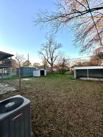 a backyard of a house with lots of green space