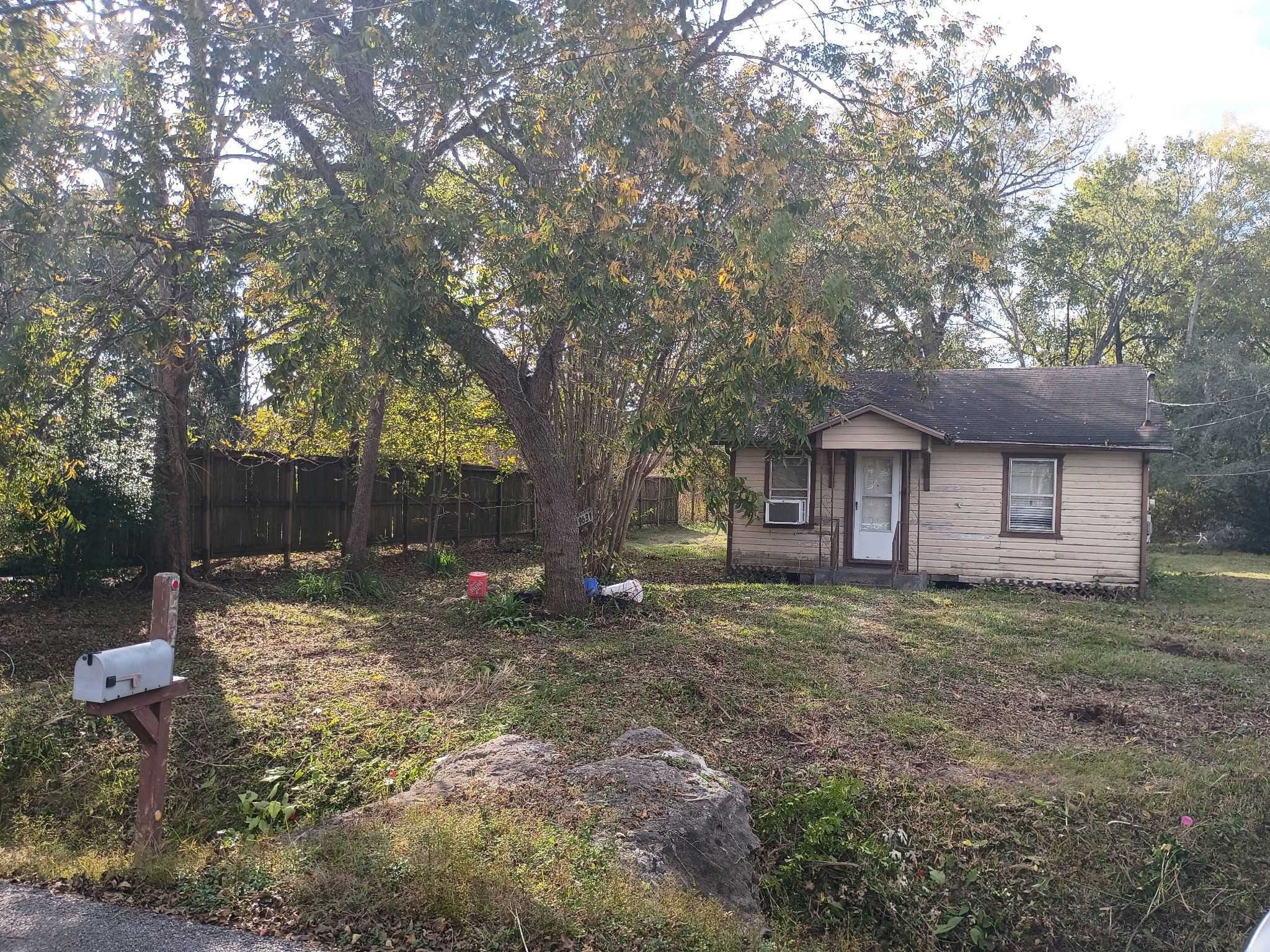 9631 Maxroy Street Houston, TX 77088 - Photo 3 of 6 a view of a house with a yard tree and sitting area