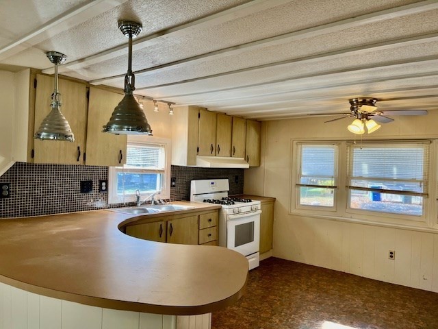 56 Contessa Lane Springfield, MA 01119 - Photo 3 of 25 a view of a kitchen with a sink a microwave and cabinets