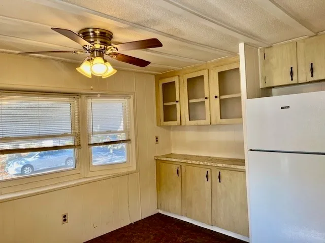 a view of a living room with a refrigerator