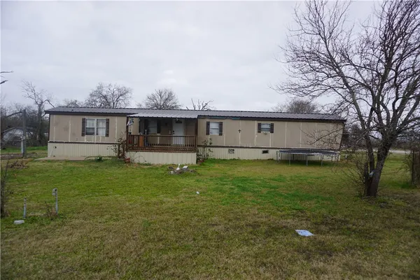 a view of house with outdoor space