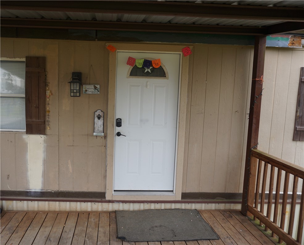 5765 Post Oak Loop Midway, TX 75852 - Photo 3 of 11 a view of a door and wooden floor