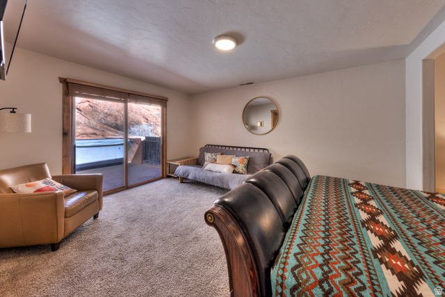3461 Westwater Road, Unit 6 Moab, UT 84532 - Photo 16 of 33 Carpeted bedroom featuring access to exterior