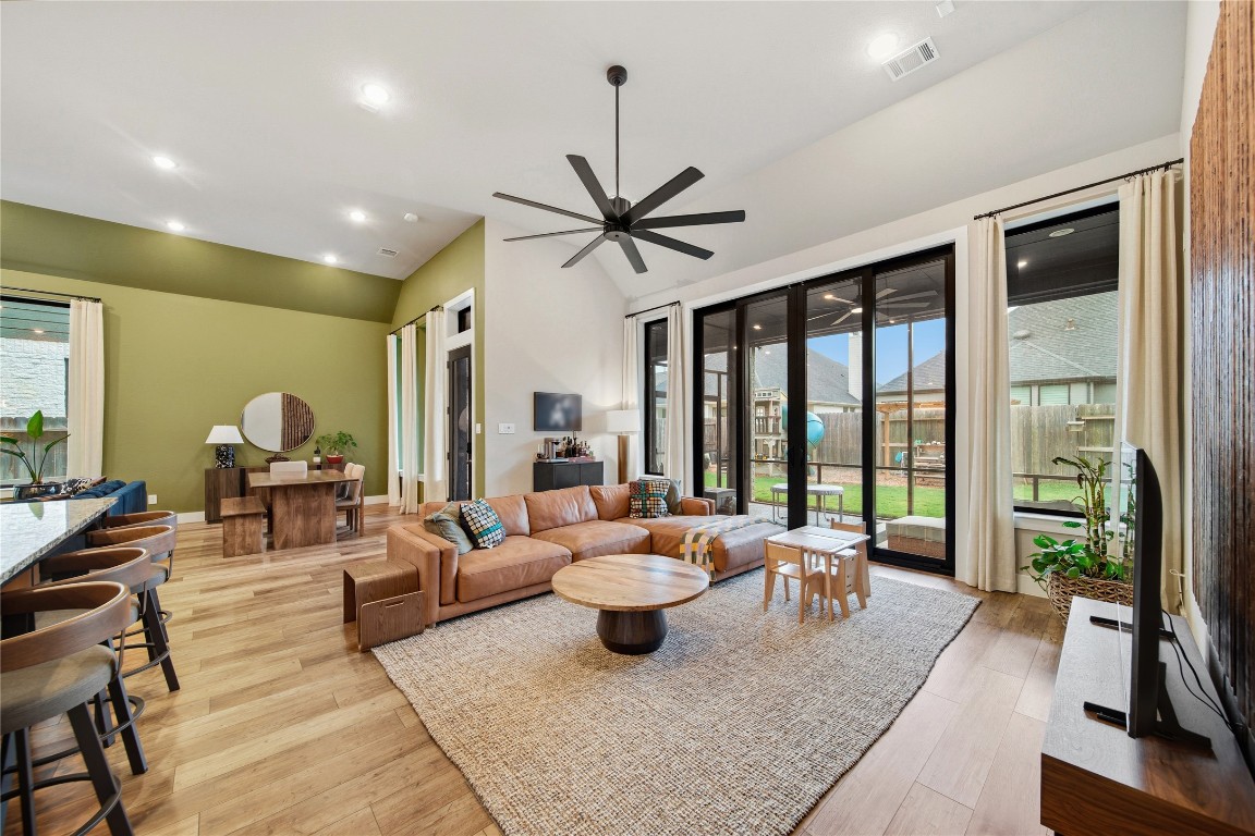 8902 Iron Forge Road Missouri City, TX 77459 - Photo 12 of 44 a living room with furniture ceiling fan and a large window