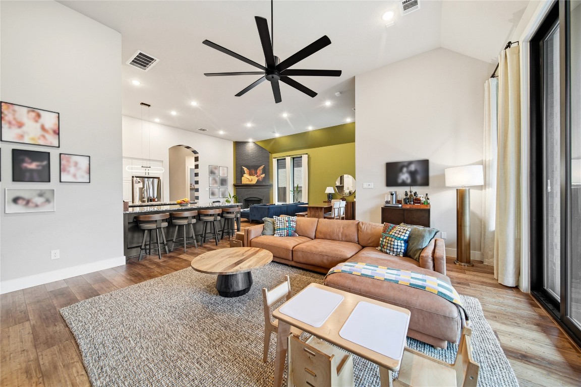 8902 Iron Forge Road Missouri City, TX 77459 - Photo 13 of 44 a living room with furniture and a view of kitchen