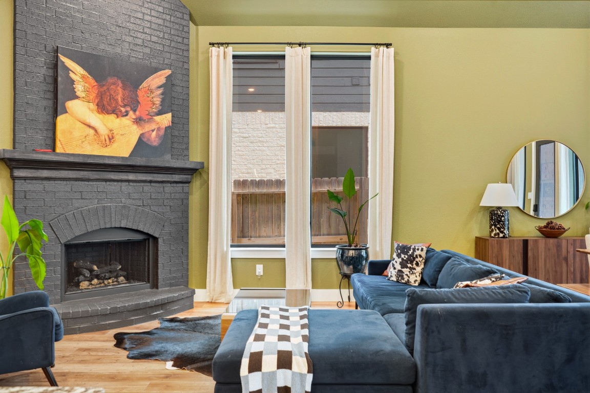 8902 Iron Forge Road Missouri City, TX 77459 - Photo 17 of 44 Living room with gas wood-burning fireplace.