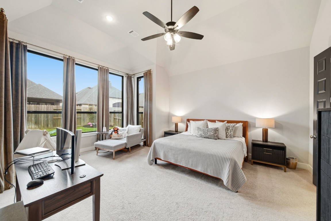8902 Iron Forge Road Missouri City, TX 77459 - Photo 21 of 44 a bedroom with a bed couches and a large window