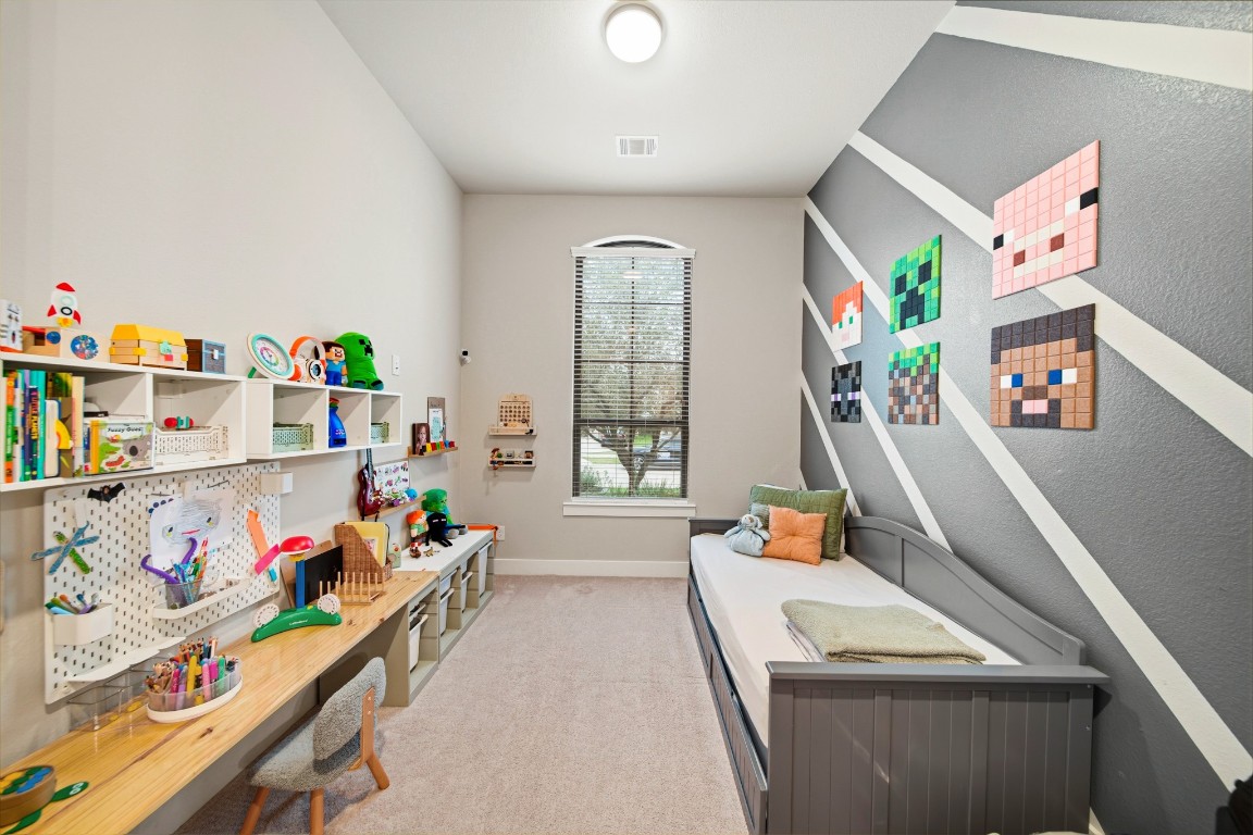 8902 Iron Forge Road Missouri City, TX 77459 - Photo 30 of 44 a bedroom with furniture a flat screen tv and a bed