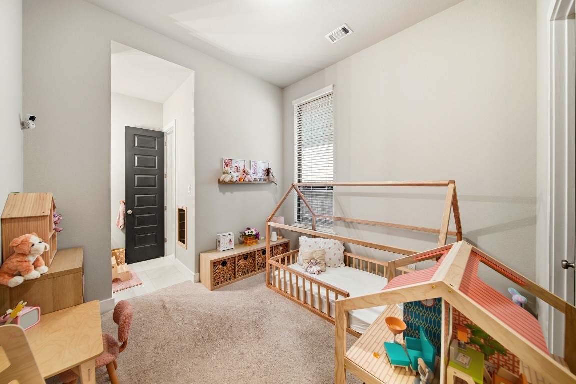 8902 Iron Forge Road Missouri City, TX 77459 - Photo 33 of 44 a bedroom with a bed and a mirror