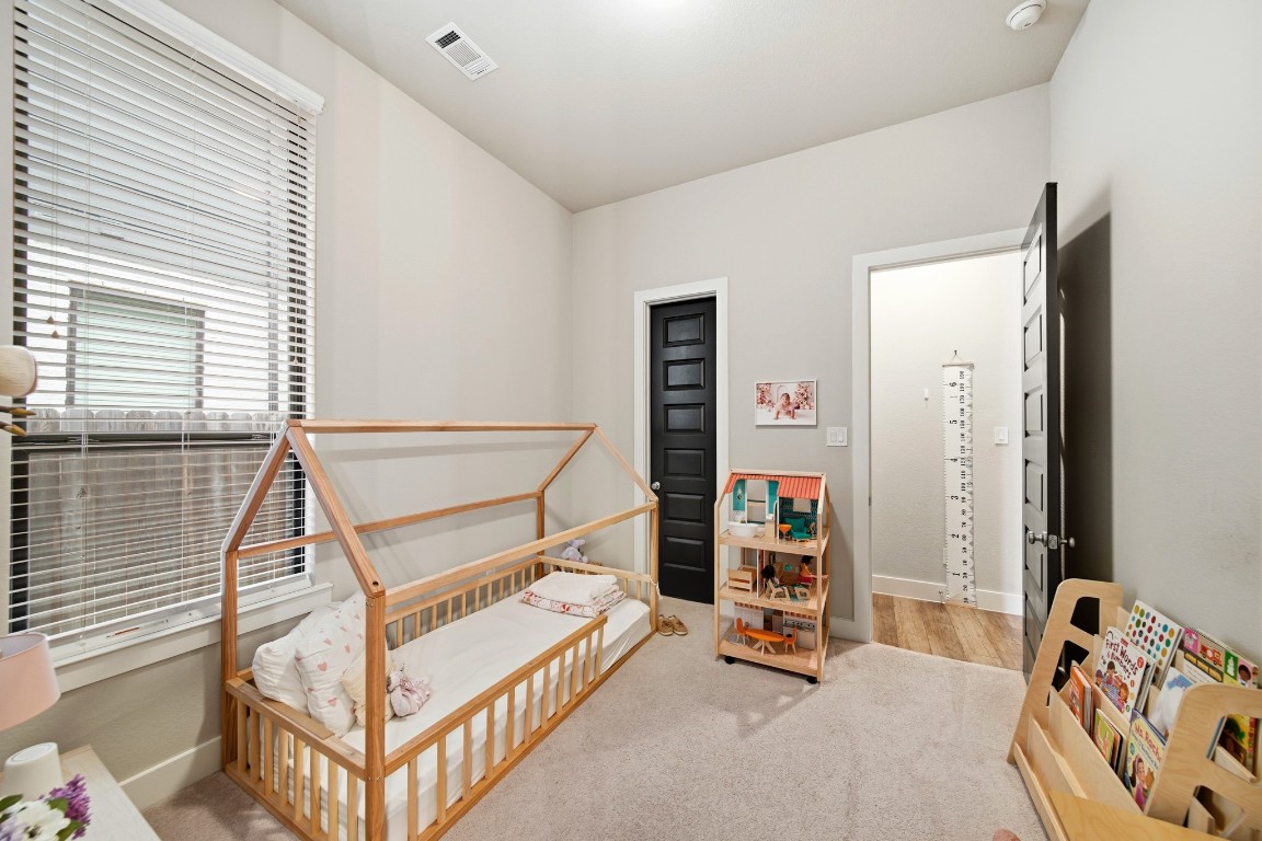8902 Iron Forge Road Missouri City, TX 77459 - Photo 34 of 44 a bedroom with bunk beds and a window