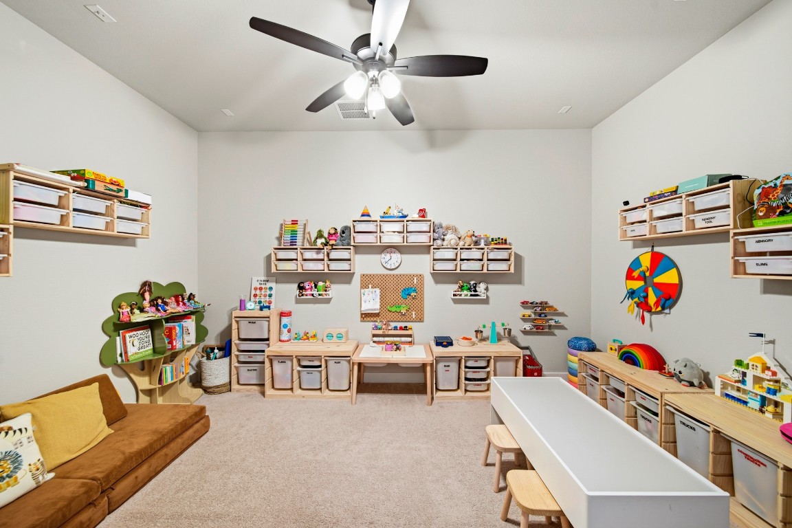 8902 Iron Forge Road Missouri City, TX 77459 - Photo 37 of 44 a bedroom with furniture a baby bed and a window