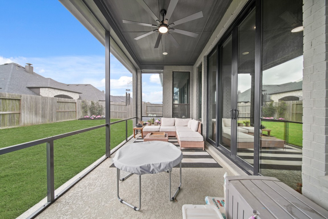 8902 Iron Forge Road Missouri City, TX 77459 - Photo 40 of 44 Spacious fully screened patio which connects to the family room as well as the outdoor kitchen.