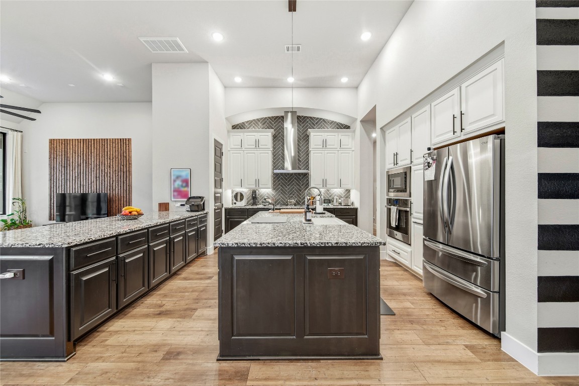 8902 Iron Forge Road Missouri City, TX 77459 - Photo 9 of 44 You (or your chef) will love this kitchen. Some of the appliances can be controlled by the Smart Technology in the home.