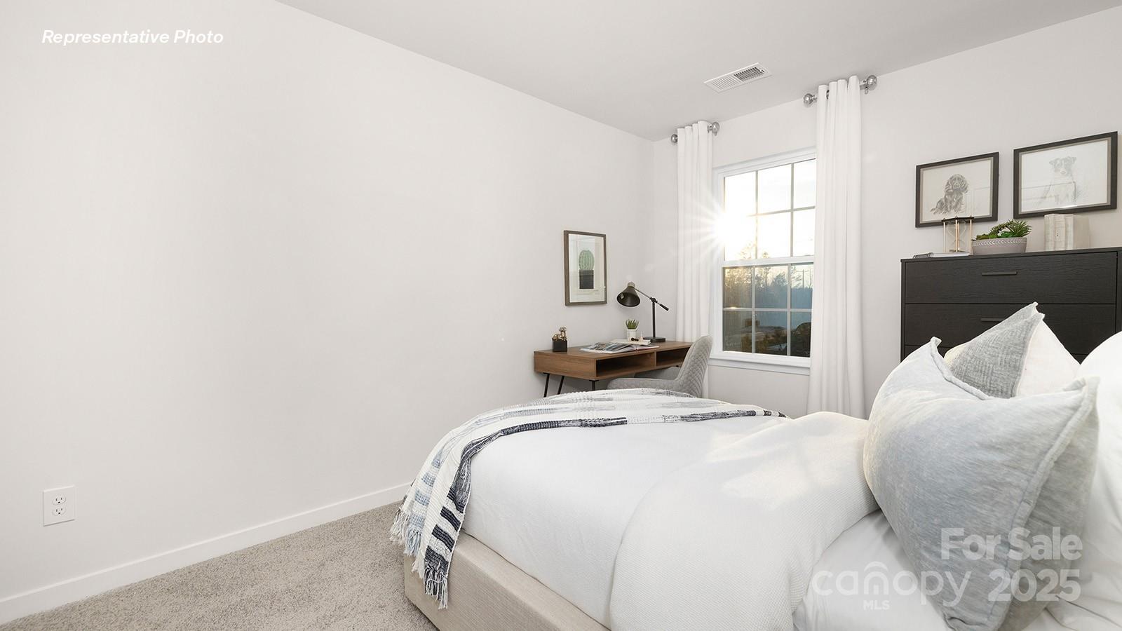 1049 Horizon Lane Chester, SC 29706 - Photo 18 of 28 a bedroom with a bed and a large mirror