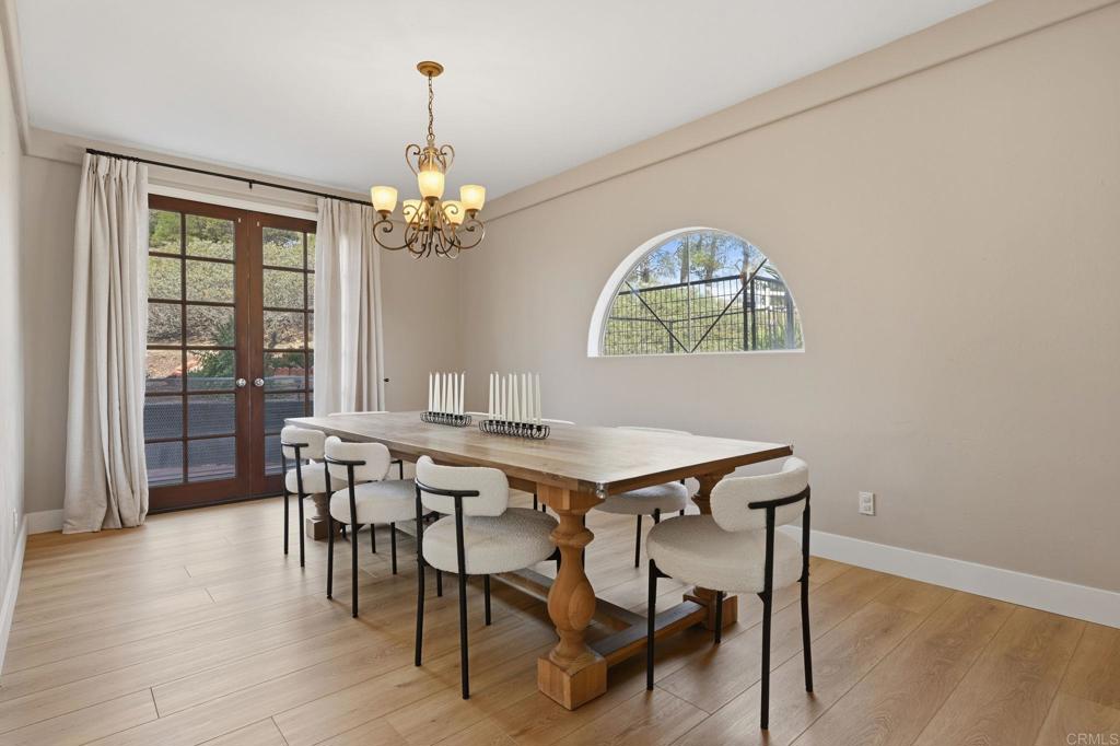 2852 Conestoga Court Alpine, CA 91901 - Photo 14 of 65 a view of a dining room with furniture wooden floor and chandelier