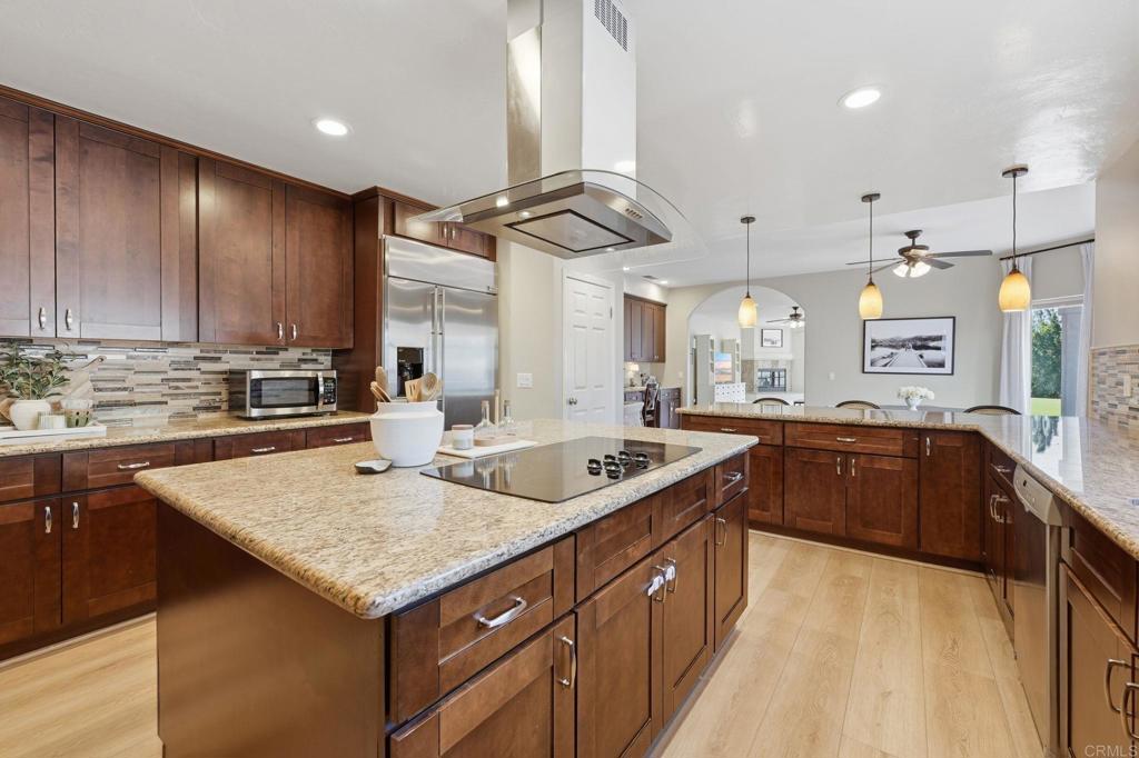 2852 Conestoga Court Alpine, CA 91901 - Photo 18 of 65 a kitchen with stainless steel appliances granite countertop a sink counter space cabinets and a window