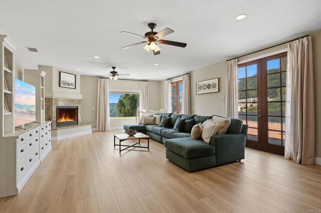 2852 Conestoga Court Alpine, CA 91901 - Photo 23 of 65 a living room with furniture and a fireplace