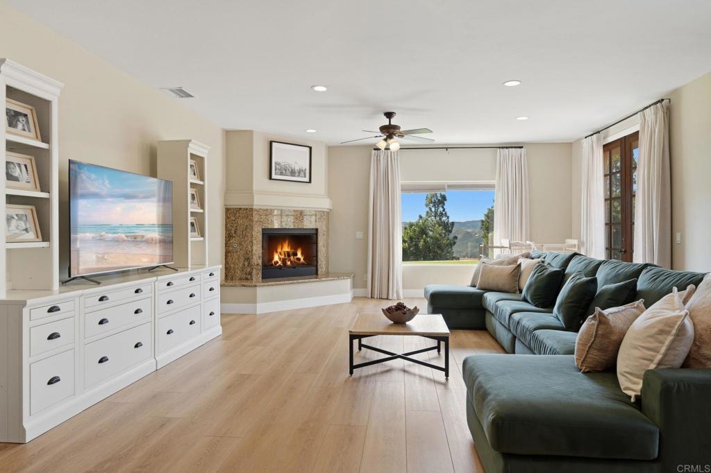 2852 Conestoga Court Alpine, CA 91901 - Photo 24 of 65 a living room with furniture fireplace and flat screen tv