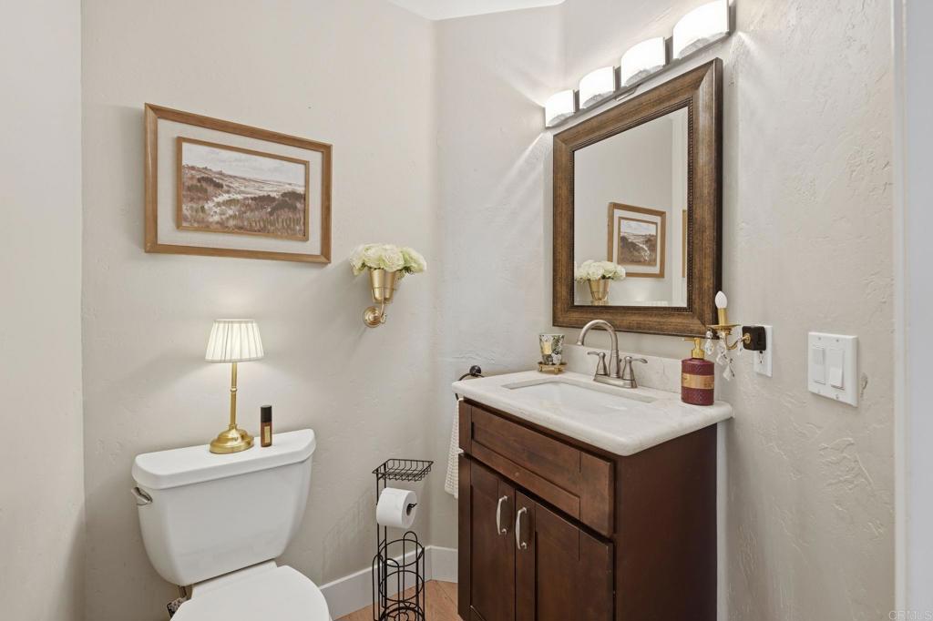 2852 Conestoga Court Alpine, CA 91901 - Photo 25 of 65 a bathroom with a toilet a sink and a mirror